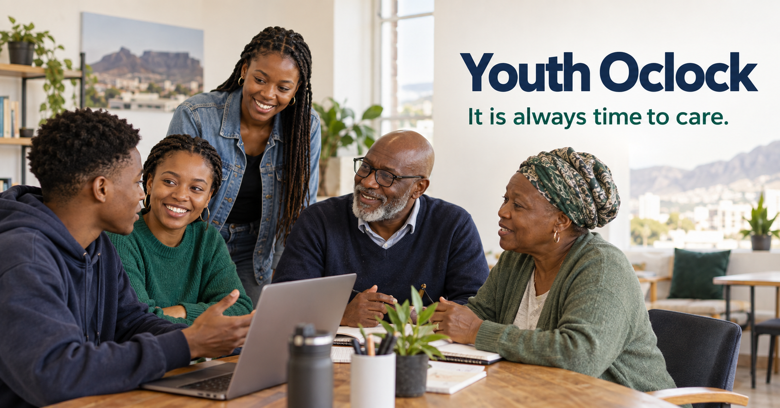Young people and older adults collaborating together around a table